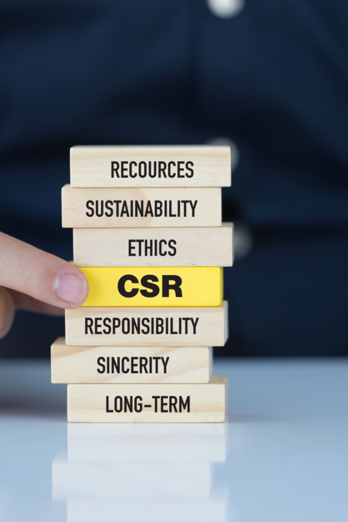 Building blocks spelling sustainability, ethics, CSR, responsibility